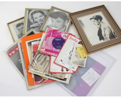 A collection of Judy Garland memorabilia to include photographs, programmes, 'Hello Bluebird' 7" single, vintage photographs,