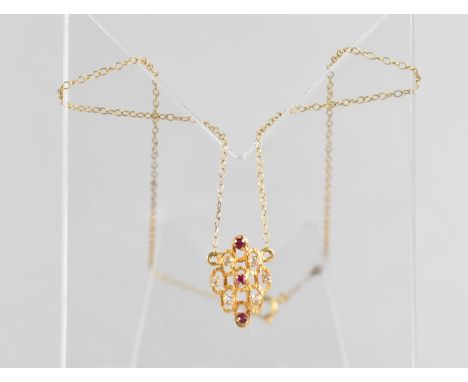 A Vintage Ruby and Diamond Cluster Pendant on Chain in the Brutalist Style comprising Three Round Faceted Rubies in a Four Cl