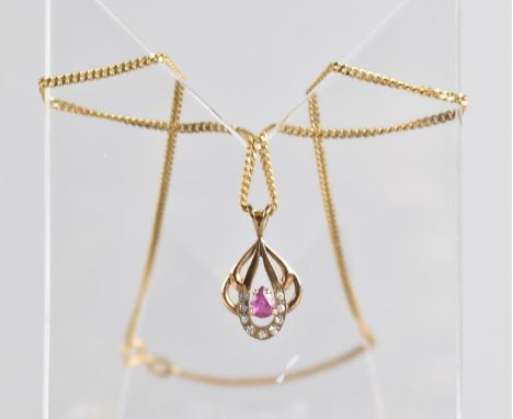A Diamond and Ruby Cluster 9ct Gold Pendant on Chain having Central Pear Cut Ruby Approx 5mm by 4mm, with Nine Round Brillian