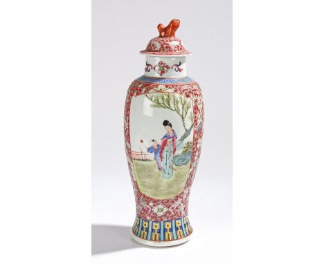 Chinese porcelain vase and cover, the foliate domed cover with dog of fo form finial, the body with white foliate scroll deco