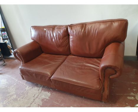 * Brown leather sofa