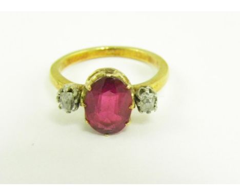 A SYNTHETIC RUBY AND DIAMOND THREE STONE RING IN GOLD, 3.4G