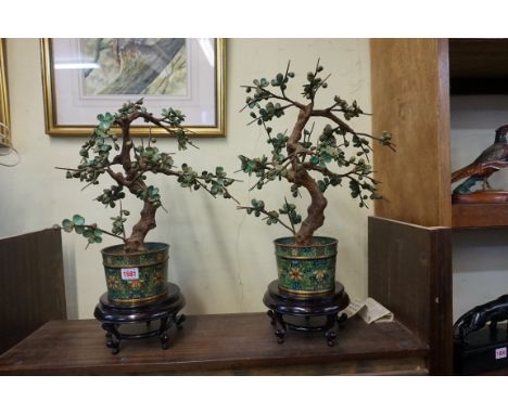 A pair of Chinese cloisonne enamel and turquoise prunus blossom tree ornaments, 44cm high, on hardwood stands. (2) 