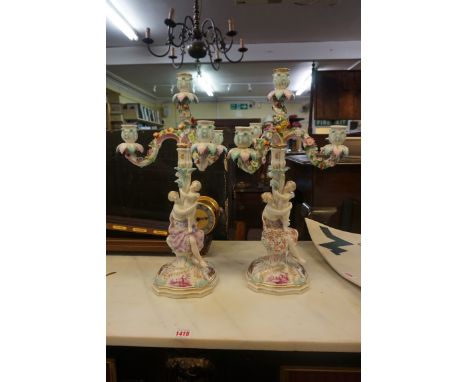 A pair of late 19th century Continental porcelain figural three branch candelabra, 49cm high.&nbsp;&nbsp; 