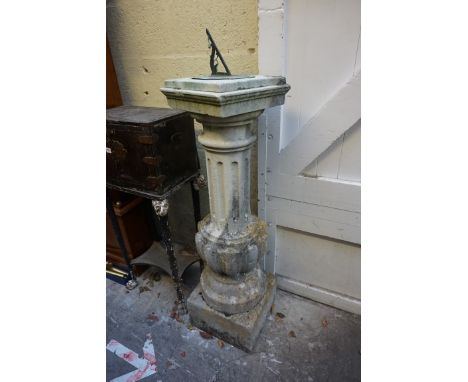 An old weathered composition stone pedestal and sundial, total height 132cm.&nbsp; 