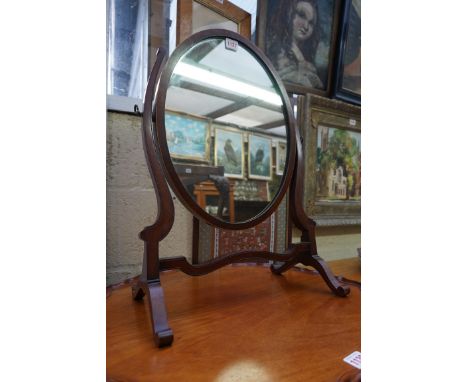 An old mahogany and boxwood strung oval skeleton toilet mirror.&nbsp; 