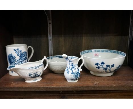 A group of Worcester first period blue &amp; white porcelain, comprising: a mug, 11.5cm high; a slop basin, 18cm diameter; a 