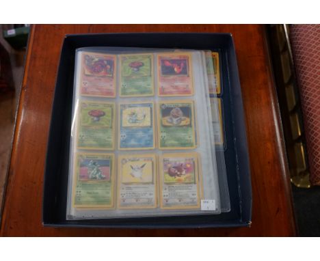 Pokemon Cards: a small group of holographic cards from the base set, jungle and fossil series; to include a first edition Mac