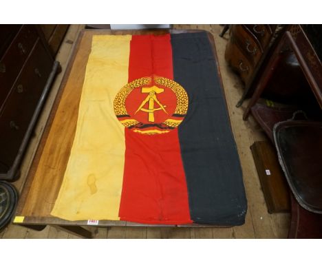 A German flag; together with a sword hanger, and an original German poster (a.f). 