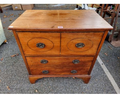 An antique mahogany commode,&nbsp;having two drawers, 67cm wide x 70cm high.&nbsp; 