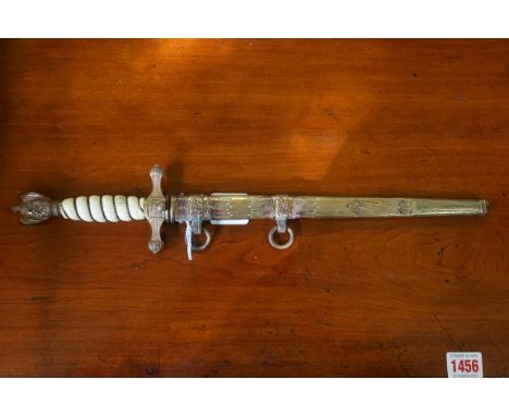 A German Third Reich Kriegsmarine Naval Officer's dagger and gilt sheath, having 24.5cm etched blade inscribed 'Original Eick