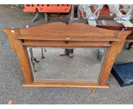 An oak overmantel mirror,&nbsp;122cm wide x 79cm high.&nbsp; 
