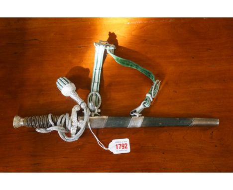 A German Third Reich Land Customs Officer's dagger and green leather sheath, the 26cm blade inscribed 'E &amp; F Horster Soli
