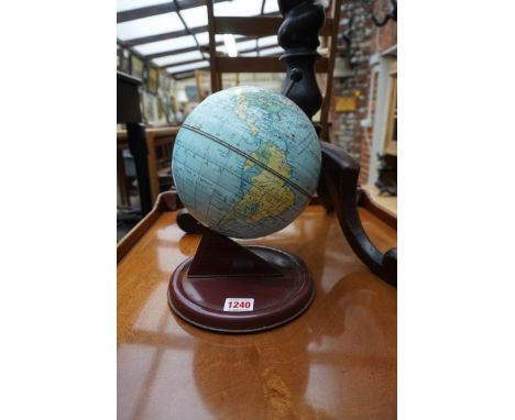 A vintage Chad Valley tin plate globe clock, 25cm high. 