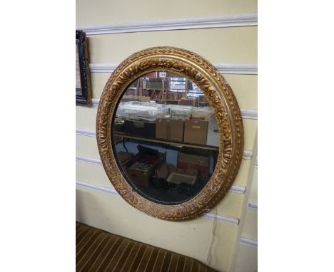 A Victorian gilt framed oval wall mirror,&nbsp;95 x 81cm.&nbsp; 