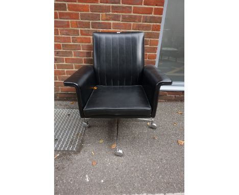 A vintage black vinyl swivel chair,&nbsp;on chrome base.&nbsp; 