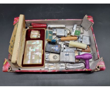 A collection of vintage lighters and related,&nbsp;to include a boxed Ronson cigarette case and lighter set; and novelty exam