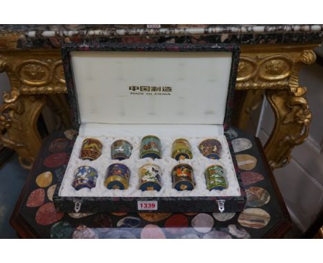 A cased set of ten Chinese cloisonne enamel boxes and covers,&nbsp;largest 5.5cm high.&nbsp; 