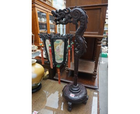 A Chinese carved wood table lamp, with hexagonal fabric shade, 69cm high.&nbsp;&nbsp; 