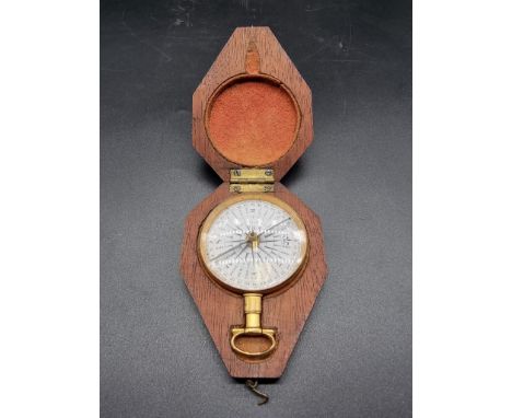 A good 19th century mahogany cased gilt brass pocket compass, with enamel dial, 5.2cm diameter. 