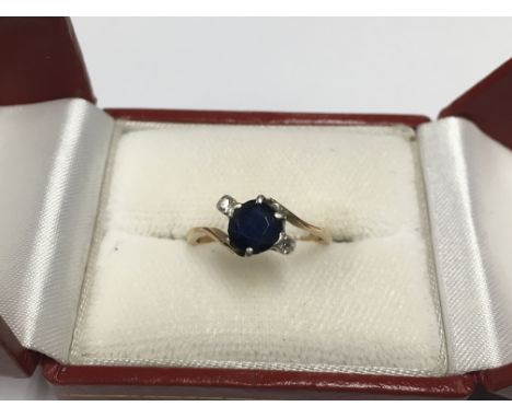 An unmarked sapphire and diamond ring.
