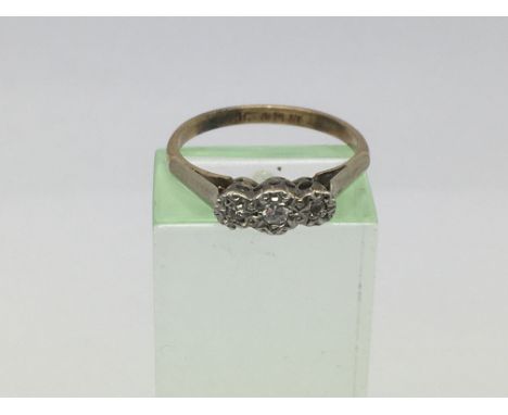 A 9ct gold and platinum three stone diamond ring, approx 1.9g and approx size L-M.