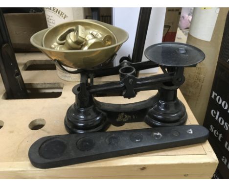 A dome topped trunk and a set of vintage scales.
