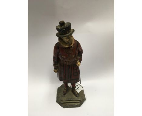 A vintage cold painted spelter figure of a beefeater.