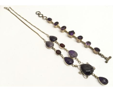 A silver and polished stone necklace and a silver and amethyst bracelet