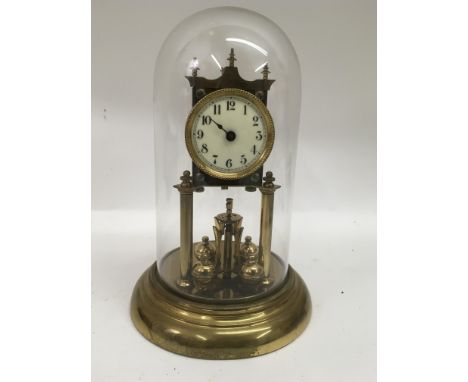 A brass anniversary clock under glass dome.Approx 30cm, a/f - NO RESERVE