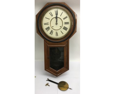A USA Ansonia wall clock with pendulum and key - NO RESERVE
