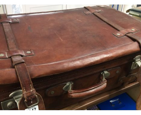 A large Quality leather vintage suite case with external leather straps. 76x47x41cm.
