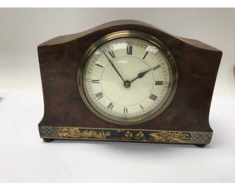 A small bur walnut mantle clock the dial with Roman numerals