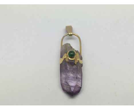 A 14ct gold quartz amethyst pendant, approx 7g.