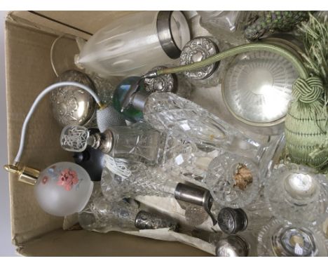 A collection of perfume bottles with silver collars and tidy jars