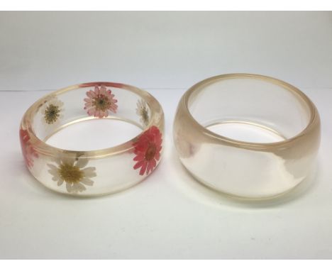 Two vintage perspex bracelets.