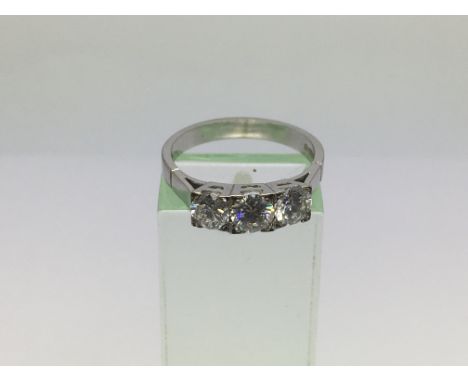 An 18ct white gold ring set with three diamonds, approx 4.2g and approx size O-P.