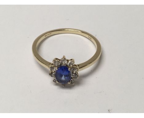 A gem stone ring with 14 k band