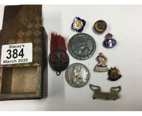 A small group of vintage scout badges, Butlins badge and 2 coins.