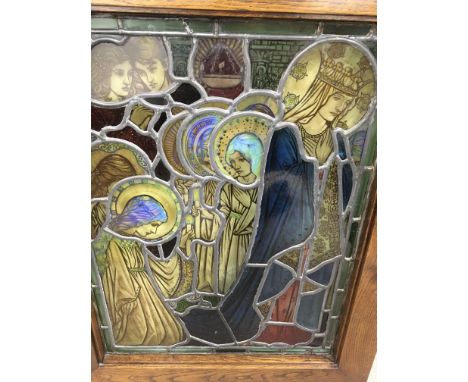 A oak framed 19 th century lead light window of religious influences in the pre Raphaelite style 75 by 55 cm frame 73 by 90 c