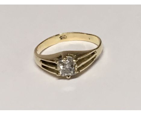 A gold ring set with an old cut solitaire diamond ring size L.