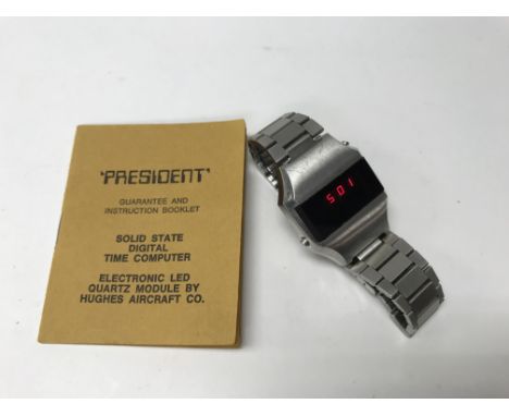 A Gents President digital display watch with guarantee and instruction booklet.