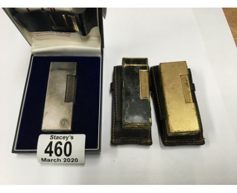 3 vintage dunhill rollagas lighters one boxed with paperwork and 2 with original leather pouches.