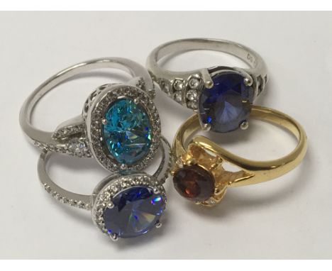 A collection of silver and gold tone rings