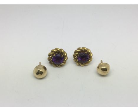 A pair of 9ct gold earrings set with amethyst plus another pair, approx 6.4g.