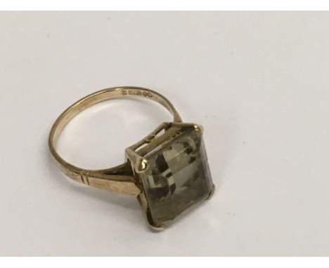 A 9ct gold ring set with a square cut citrine, approx M