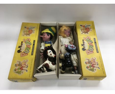 Two boxed Pelham puppets comprising Pinnochio and one other plus a cat puppet and one of a pony (4).