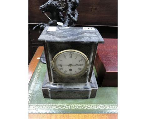 A small slate and marble mantle clock