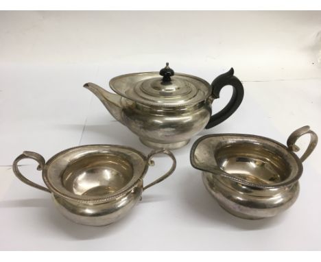 A silver three piece teaset with gadrooned edge, London hallmarks for Edward Barnard and Sons.Approx 1kg