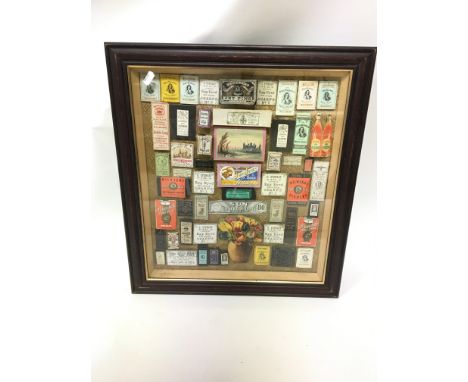 A framed collection of Victorian and vintage pin and needle packets